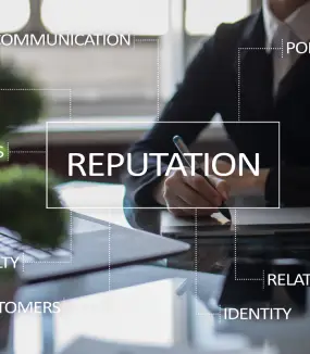 A professional setting with the word "REPUTATION" highlighted in a virtual overlay surrounded by related business words